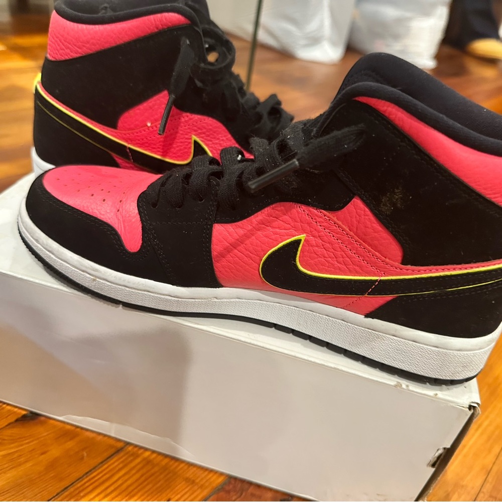 Pink and black air Jordan 1 mids